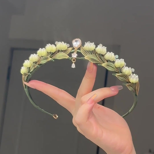 3D thread-wrapped floral crown with a soft ribbon bow and dangling pearls made using traditional Chanhua techniques.