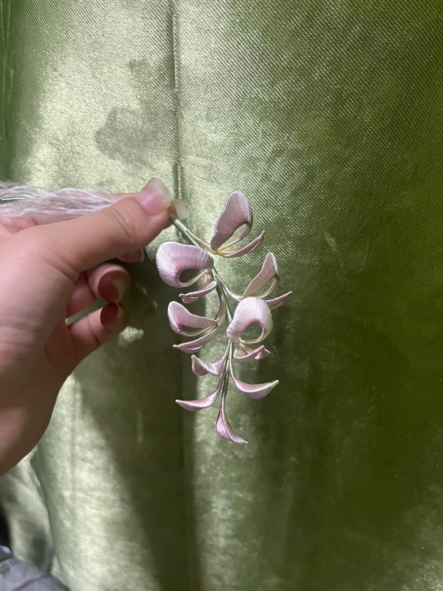 A handmade Chanhua wisteria flower accessory with pink petals and green leaves-6