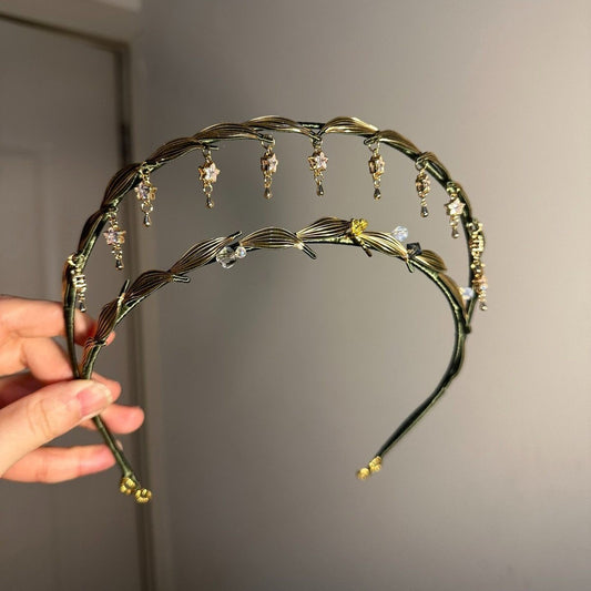 Artisanal double-layered aureola tiara with intricate thread-wrapped greenery and dangling celestial star accents.