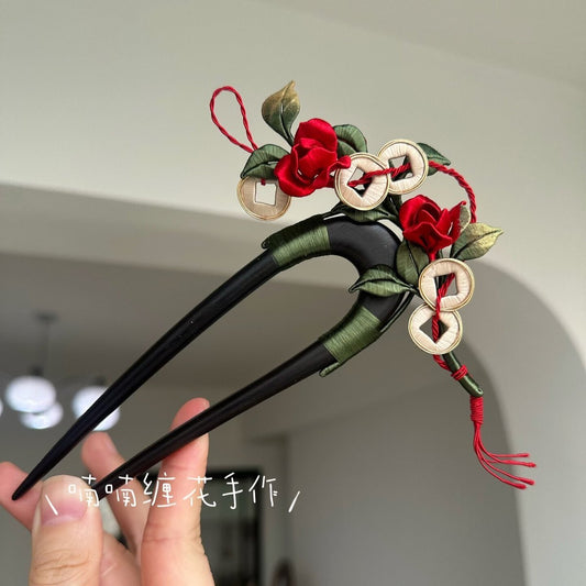 3D thread-wrapped floral hair ornament featuring traditional Chinese coin motifs and artisanal red roses.