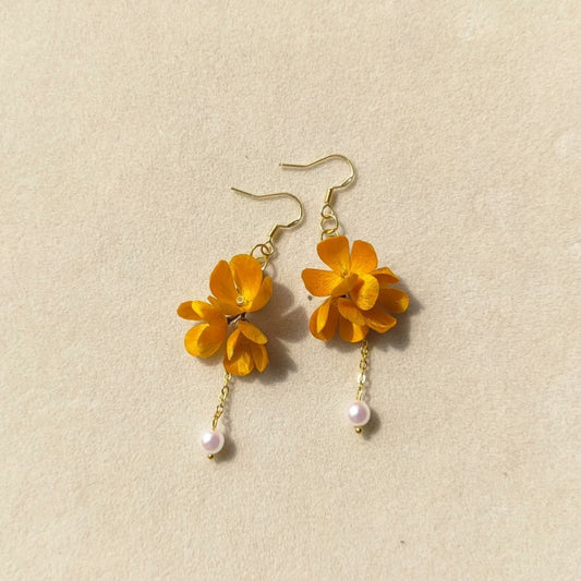 3D silk velvet flower earrings depicting yellow osmanthus clusters made with traditional artisanal Ronghua techniques.
