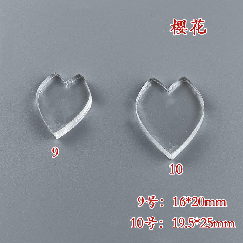 A close-up of two cherry blossom petal wire shaping templates, showing a size comparison and measurements.