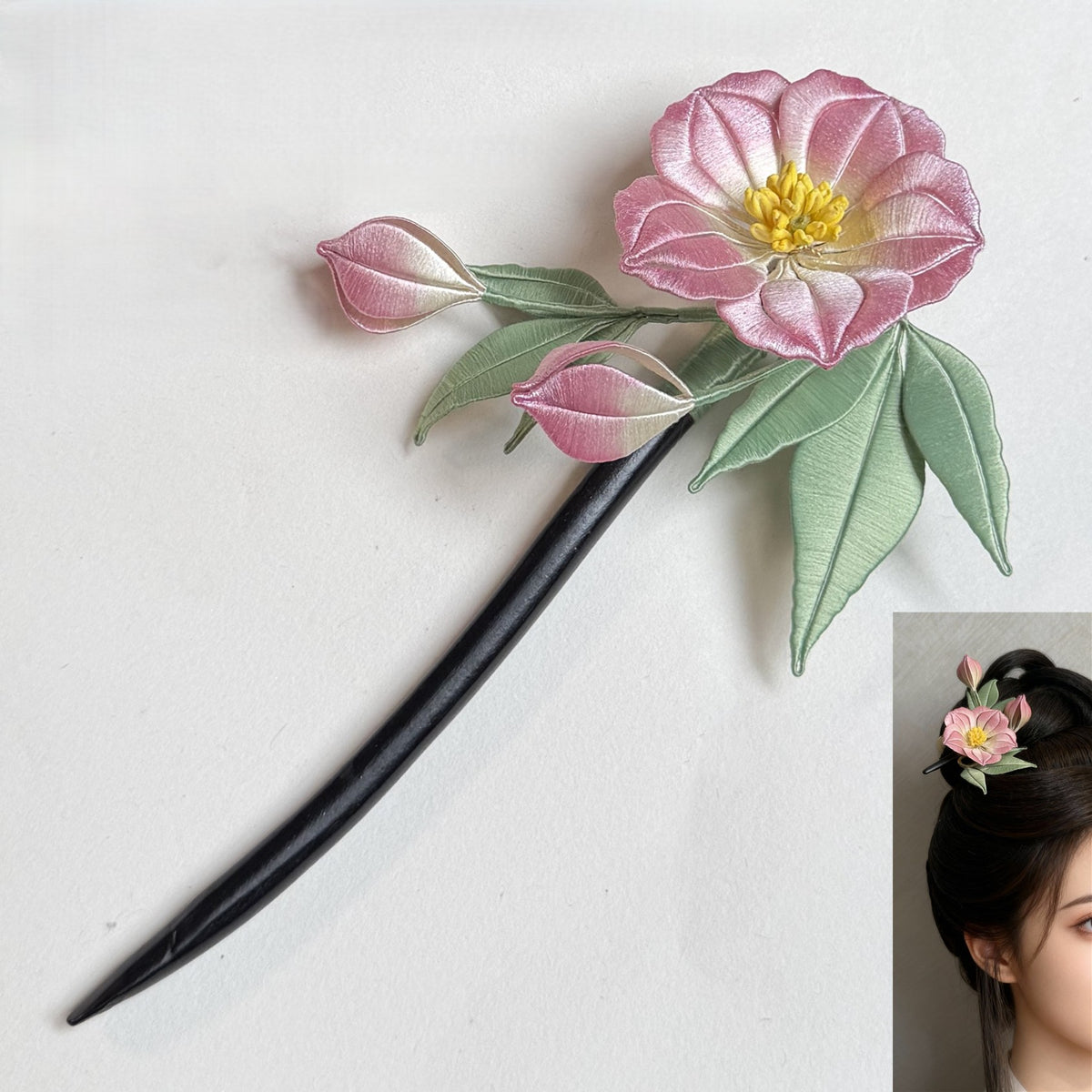 Handmade pink Cotton Rose Chanhua hairpin with green leaves on a black hair stick, shown next to a model wearing the finished floral hair accessory.