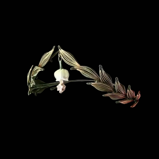 Handcrafted Athena Chanhua tiara featuring green and gold thread-wrapped laurel leaves and a central floral drop.
