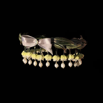 Handcrafted Lily of the Valley Chanhua headband with thread-wrapped silk flowers, green leaves, and pearl drops.