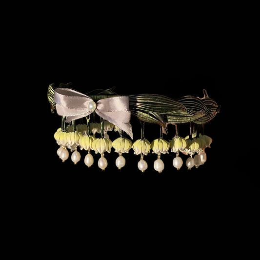 Handcrafted Lily of the Valley Chanhua headband with thread-wrapped silk flowers, green leaves, and pearl drops.