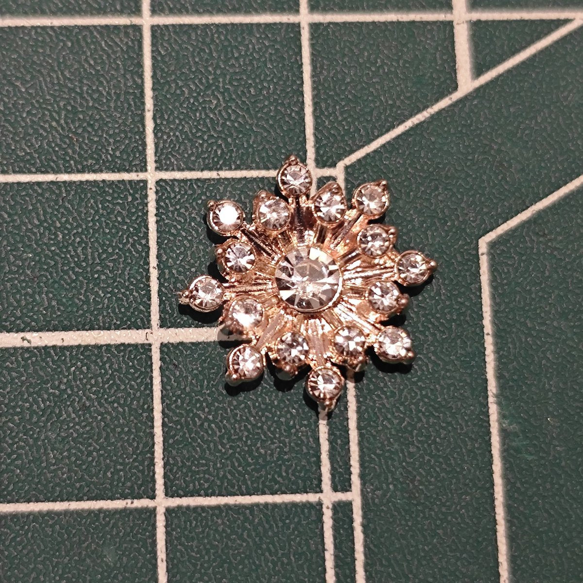 Close-up of Rose Gold-Tone Flatback Snowflake Flower Center with Center Rhinestone for Apparel Embellishment