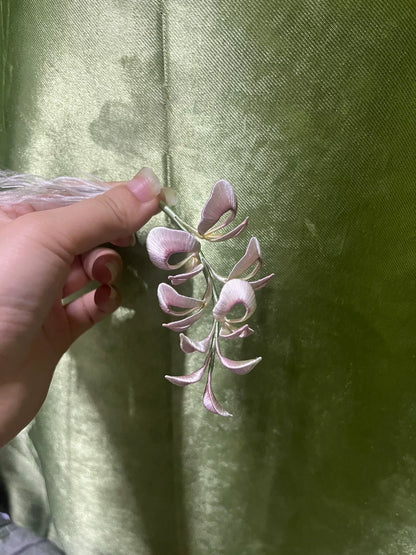 A handmade Chanhua wisteria flower accessory with pink petals and green leaves-6