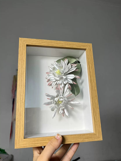 A handmade Chanhua table display in a wooden box with white and pink petals and green leaves-3