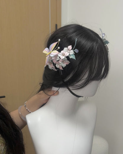 A black graduation cap adorned with handmade Chanhua hydrangea, butterfly, and a lavender bow-4