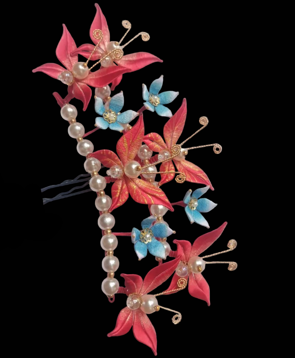 Handcrafted Chanhua hair fork featuring thread-wrapped red butterflies, blue flowers, and a row of elegant pearls.