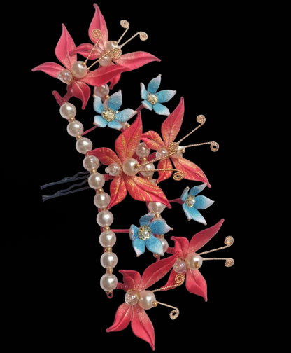 Handcrafted Chanhua hair fork featuring thread-wrapped red butterflies, blue flowers, and a row of elegant pearls.
