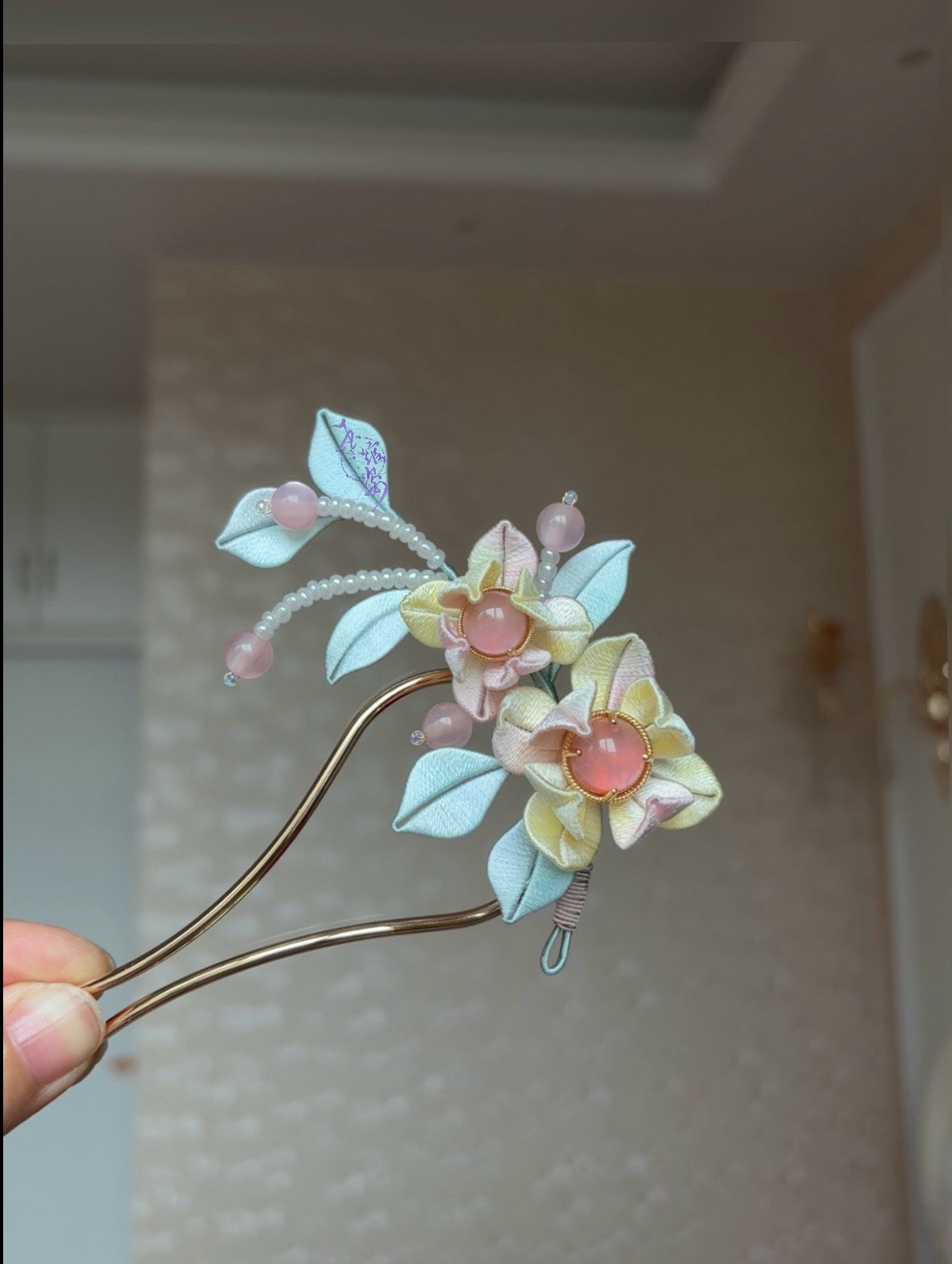 Pink - blue handmade Chanhua hairpin adorning a woman's hairstyle-3