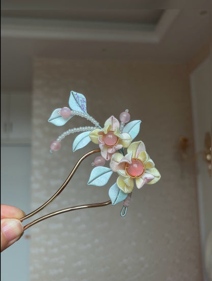 Pink - blue handmade Chanhua hairpin adorning a woman's hairstyle-3