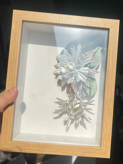 A handmade Chanhua table display in a wooden box with white and pink petals and green leaves-6