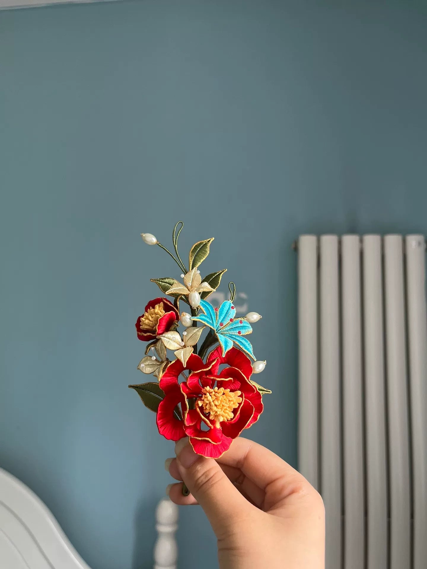 A handmade Chanhua hairpin and brooch with red flowers, green leaves, white flowers, a blue butterfly, and pearls-4
