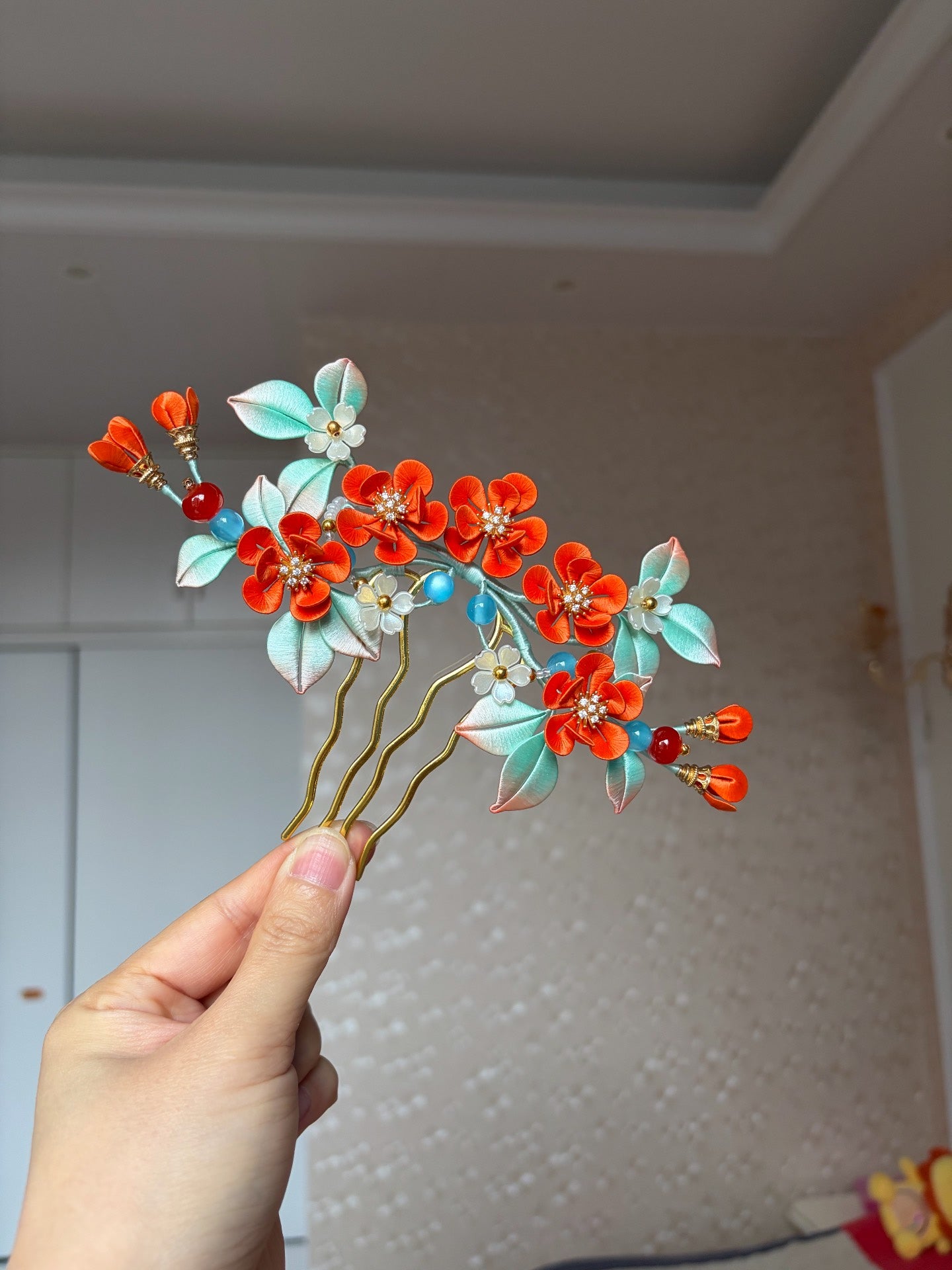 Orange - colored handmade Chanhua hair comb on a woman's hair-3