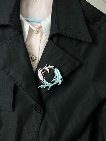 A handmade Chanhua Qiyu little fish brooch on a black coat-6