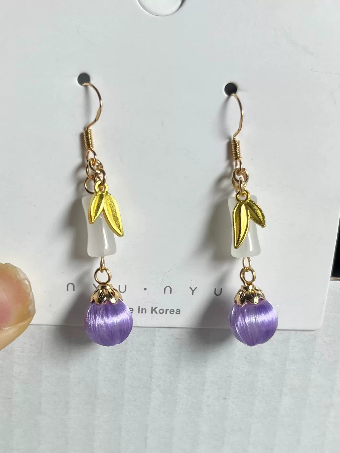 Handmade Chanhua earrings with a pink flower, blue leaves, a golden charm, and a pearl-4