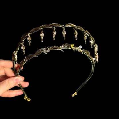 Handcrafted Chanhua Madonna crown featuring dark green thread-wrapped leaves and shimmering crystal star charms.
