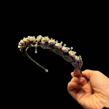 Handcrafted Chanhua princess tiara featuring pale yellow thread-wrapped Lily of the Valley flowers and green leaves with a central crystal drop.