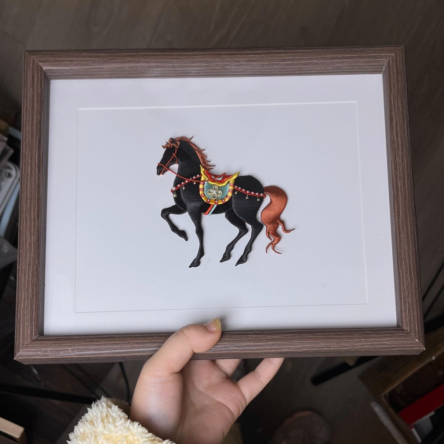 A hand - held handmade Chanhua horse ornament with a black body and orange mane and tail-3
