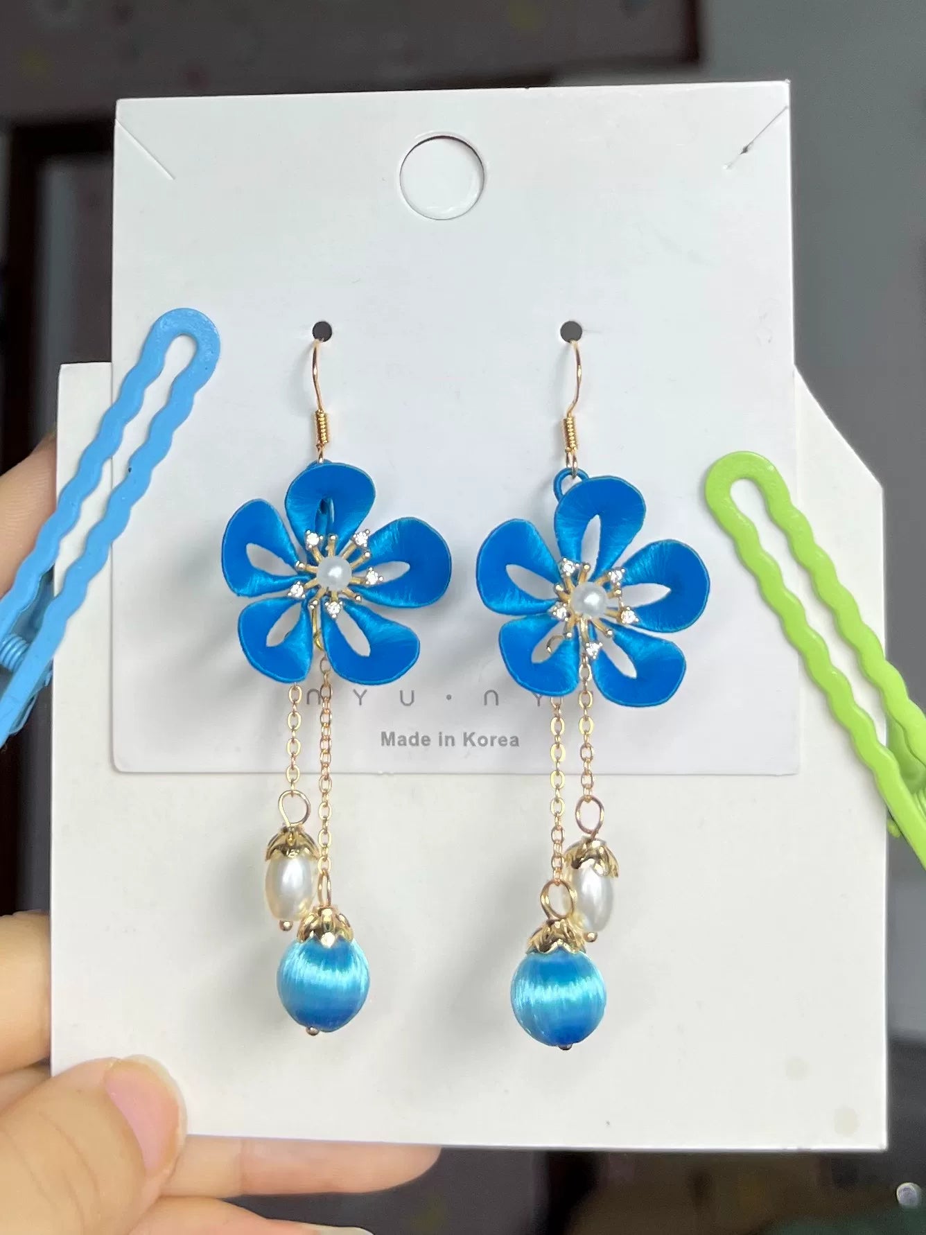 Handmade Chanhua earrings with a pink flower, blue leaves, a golden charm, and a pearl-6