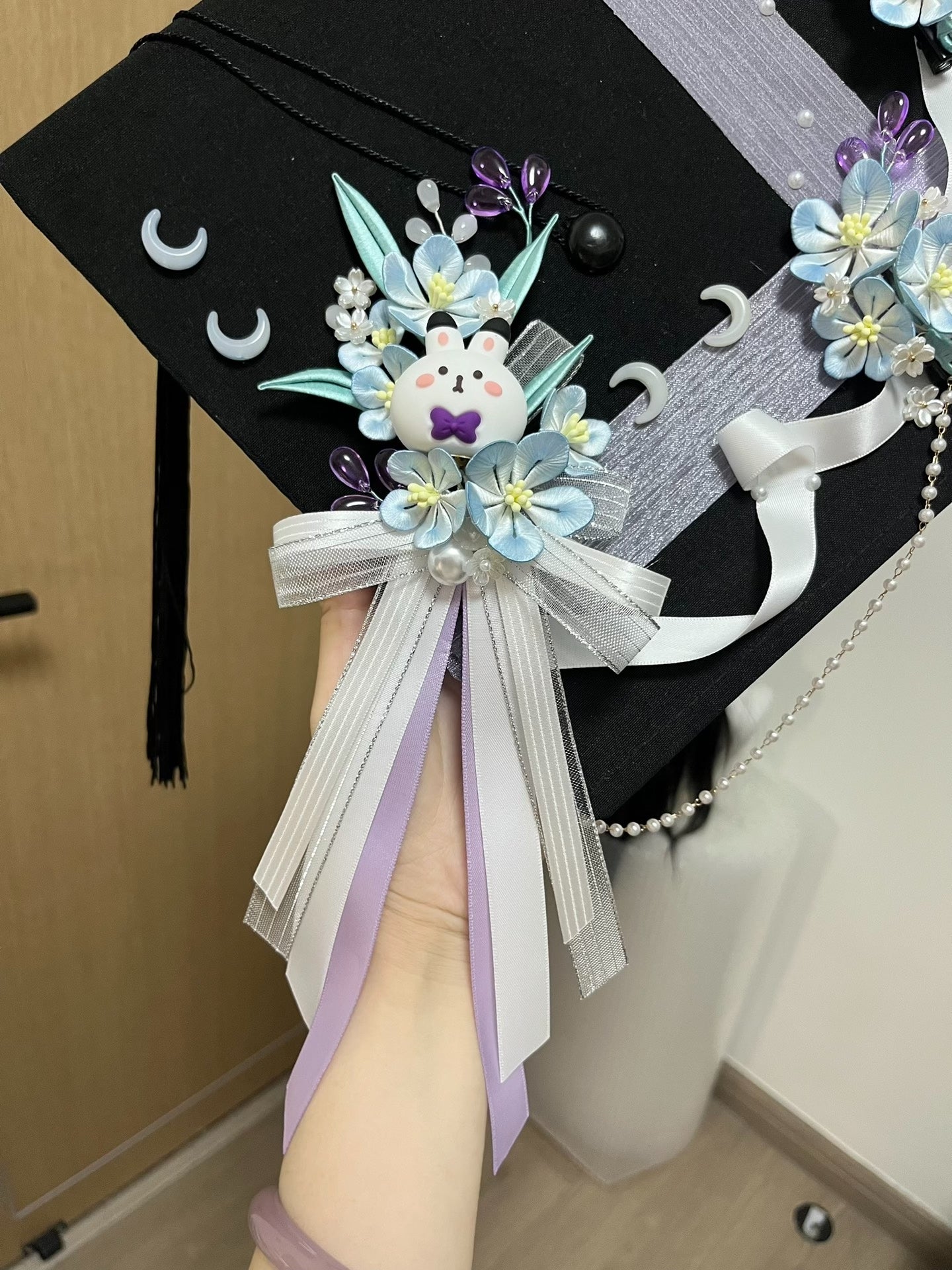 Handmade Chanhua - decorated graduation cap with a cute bunny and floral elements