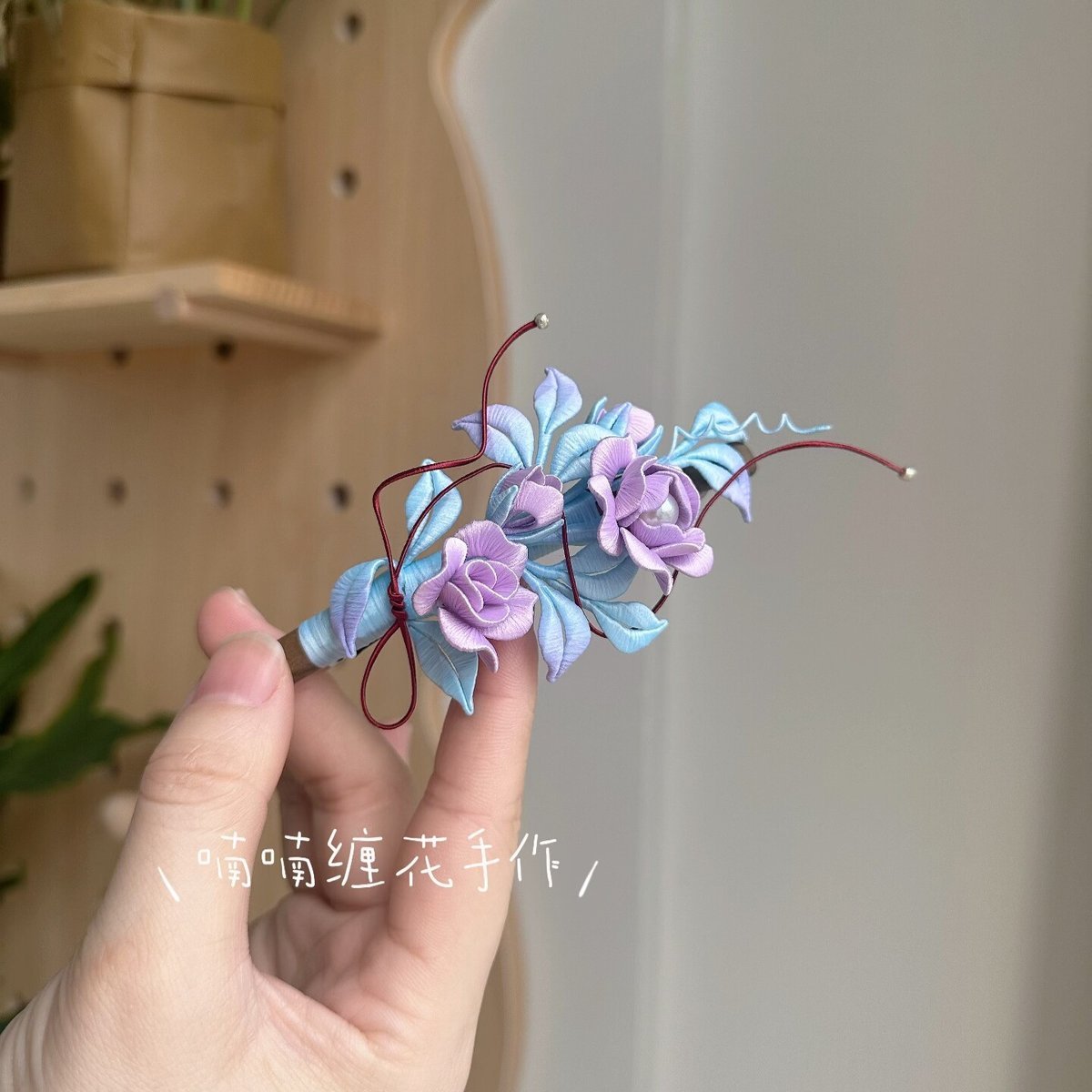 3D thread-wrapped floral hair accessory featuring artisanal purple roses made with traditional Chanhua techniques.