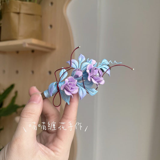 3D thread-wrapped floral hair accessory featuring artisanal purple roses made with traditional Chanhua techniques.