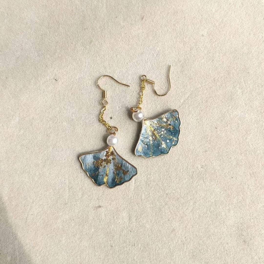 silk velvet leaf jewelry depicting artisanal Ginkgo Biloba leaves made with traditional Ronghua techniques on gold-tone hooks.