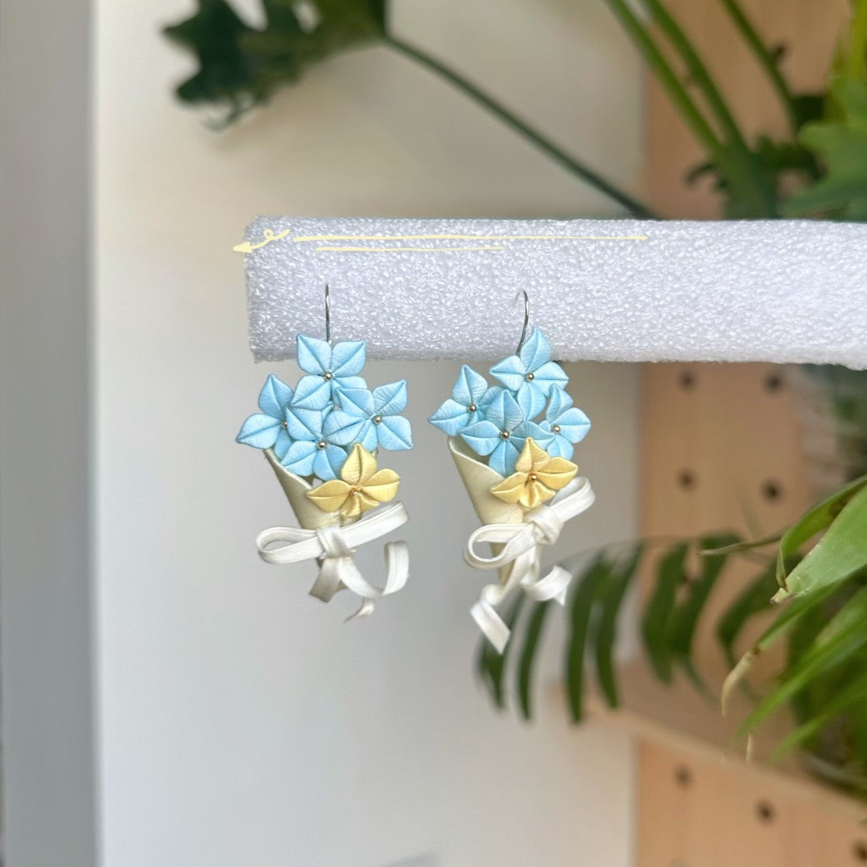 3D thread-wrapped floral earrings featuring a tiny flower bouquet design made with traditional Chanhua techniques.