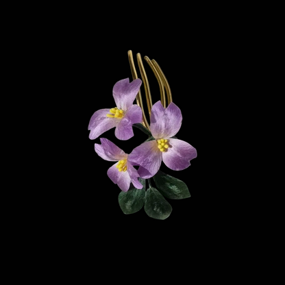 Handcrafted Ronghua violet hair comb featuring soft purple velvet-textured silk petals with yellow stamens and green leaves.