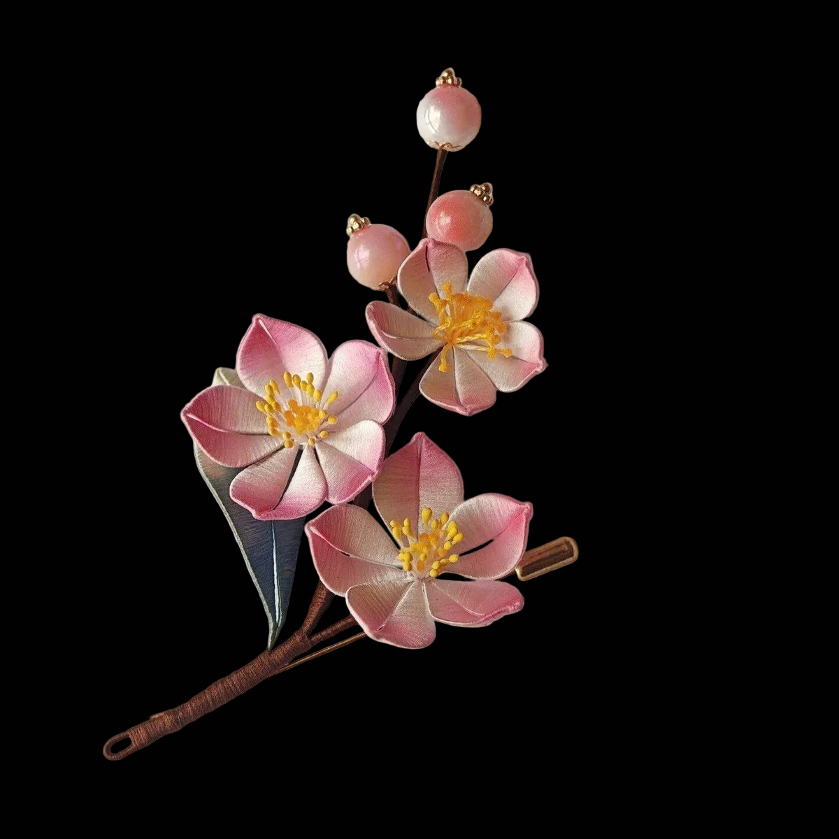 Handcrafted Chanhua brooch featuring pink and white thread-wrapped peach blossoms with yellow stamens and pink bead accents.