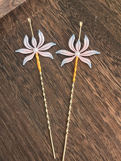 Two handmade Chanhua orchid - patterned ear - pick hairpins held by a hand-2