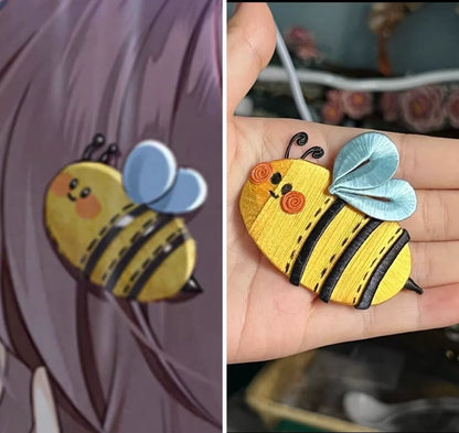 A handmade little bee hair clip that can be used as a brooch, with yellow - black body, blue wings, and cute eyes