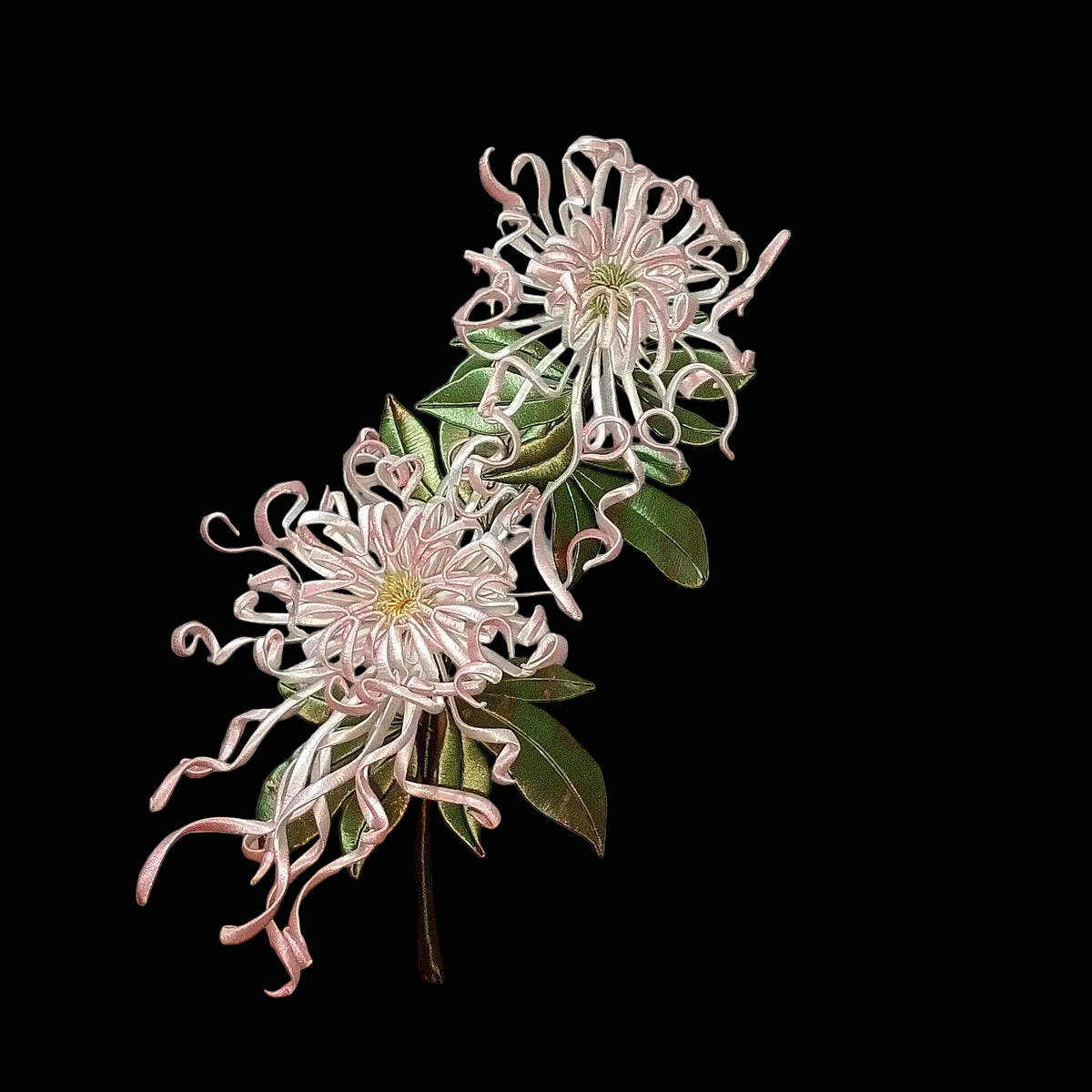Detailed view of a single pink Chanhua chrysanthemum ornament showing the intricate thread-wrapped curled petals and green foliage.