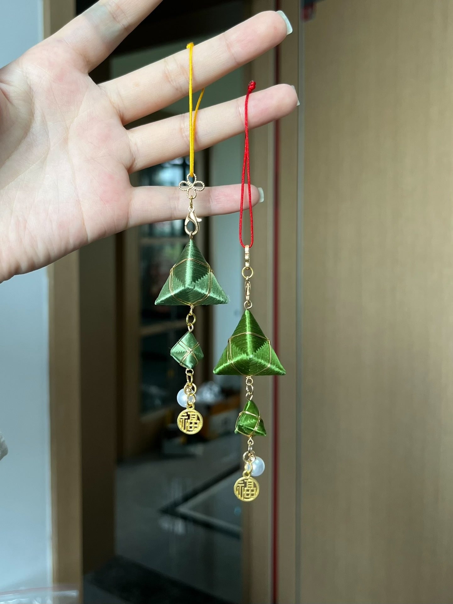 Handmade Chanhua zongzi - shaped earrings and charms with green color, golden accents and lucky "Fu" emblem