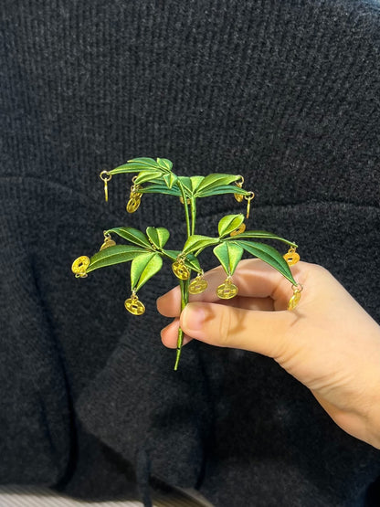 A handmade Chanhua money tree ornament in a light - blue pot with green leaves and golden coins-3