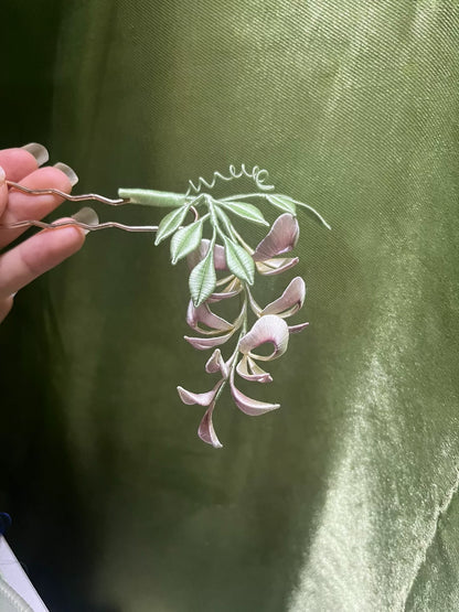A handmade Chanhua wisteria flower accessory with pink petals and green leaves-5