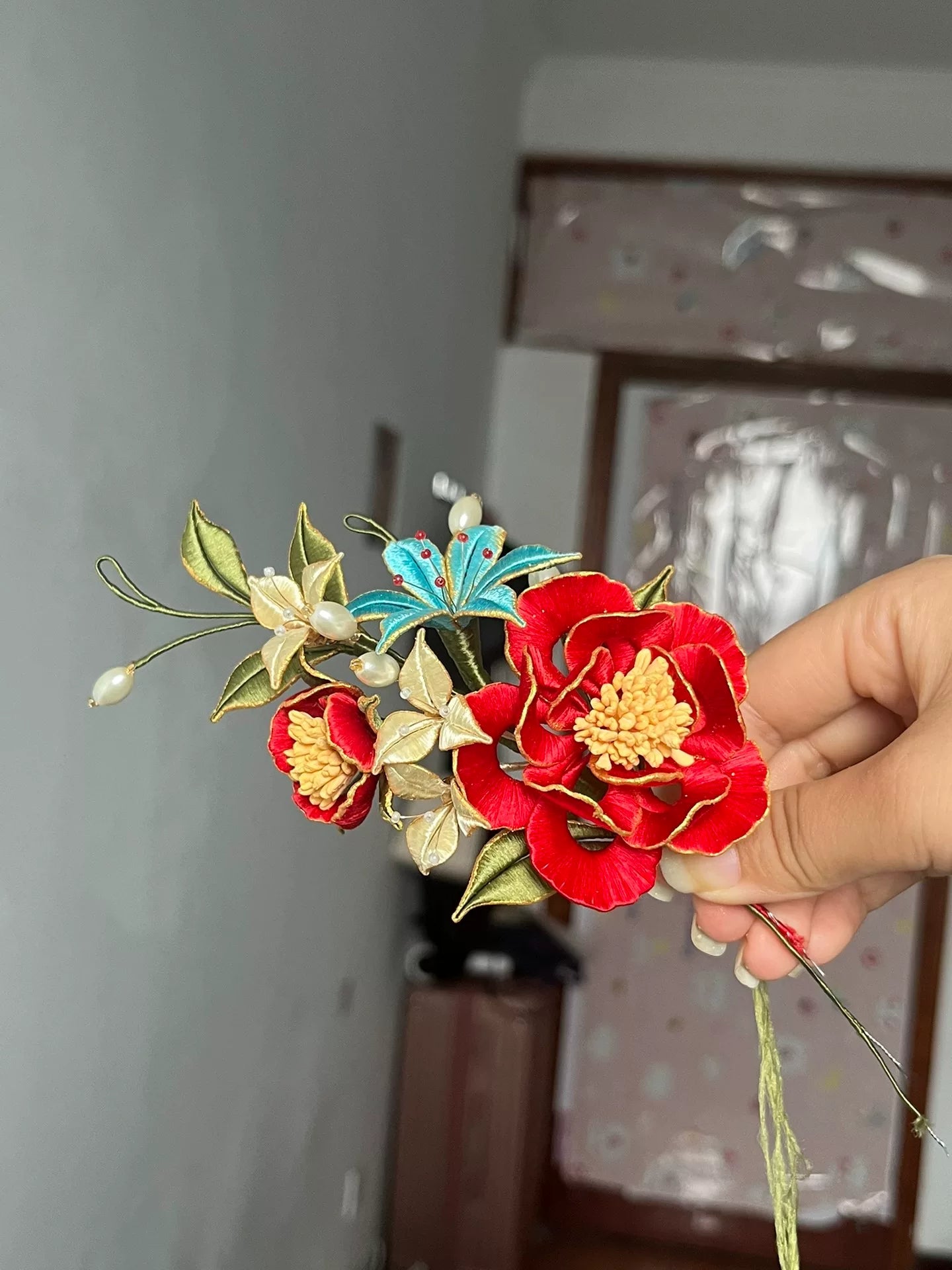 A handmade Chanhua hairpin and brooch with red flowers, green leaves, white flowers, a blue butterfly, and pearls-6