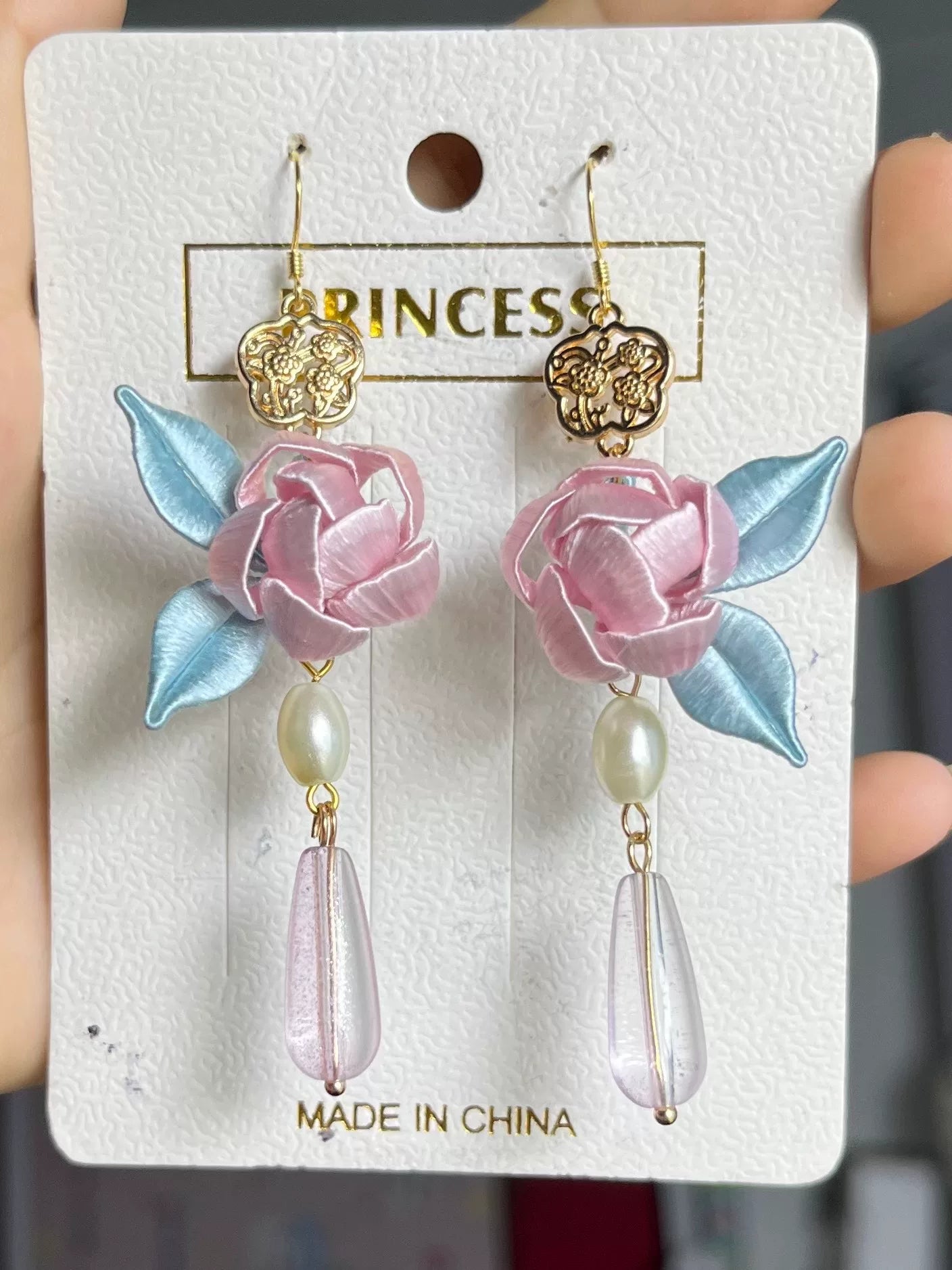 Handmade Chanhua earrings with a pink flower, blue leaves, a golden charm, and a pearl-3