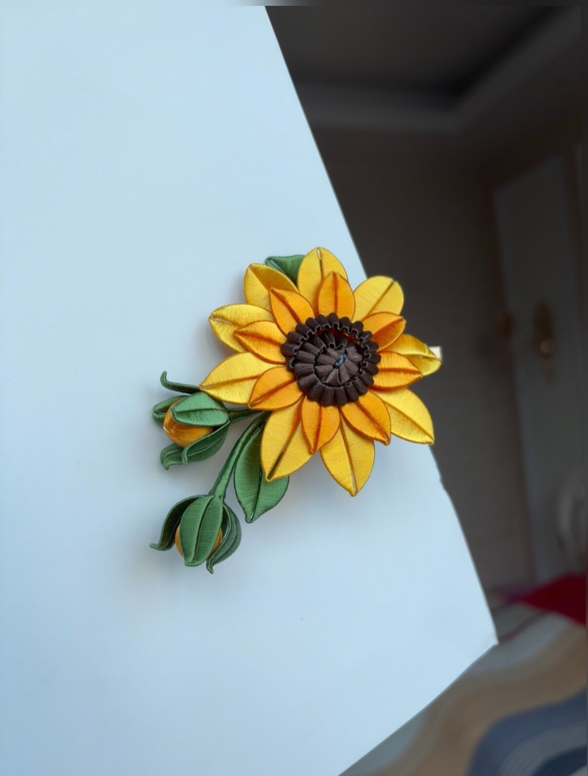 Handmade Chanhua sunflower hair clip on a white surface-4