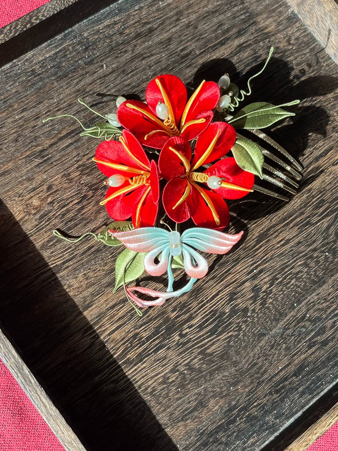 A handmade Chanhua morning glory hairpin with pink flowers and blue - green leaves on a wooden tray-5