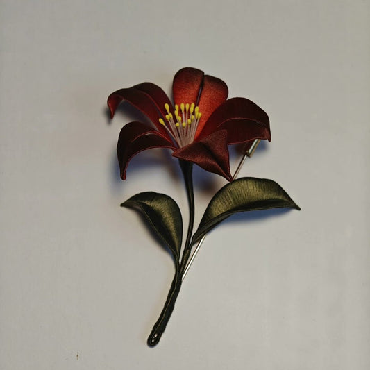 3D thread-wrapped mystical floral pin made with intricate artisanal Chanhua techniques in black and red.