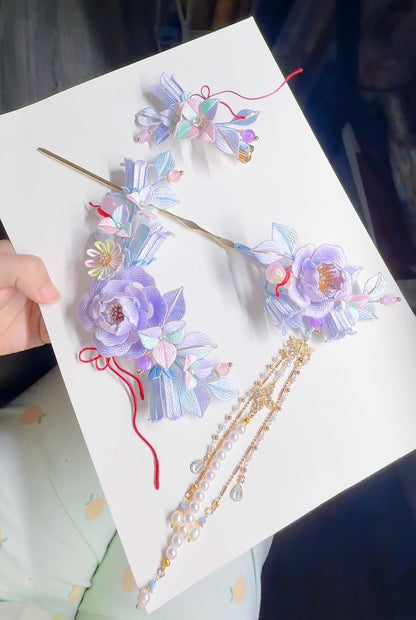 Handmade Chanhua three - piece set with tassel, showcasing floral designs in soft purple and blue