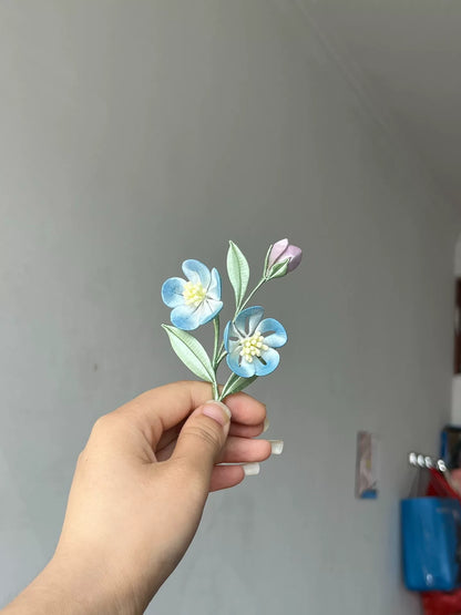 A hand - made Chanhua hair clip with blue flowers, green leaves and a budding flower-2